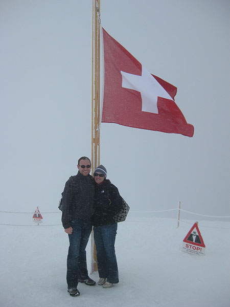 Amy and Adam on Mountian under Swiss Flag